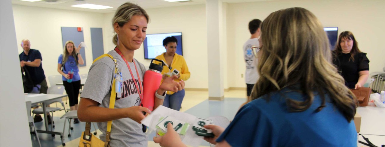 UC nursing students receive Narcan nasal spray after training on recognizing an opioid overdose and how to administer naloxone