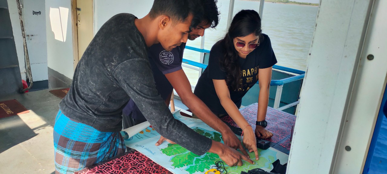 Radhika Bhargava points out a location on a map of the Sundarbans mangrove forest.