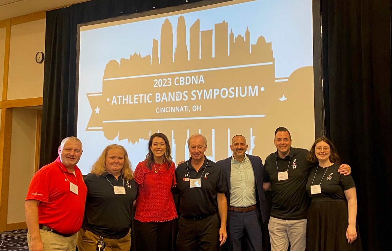 Student Affairs staff pose with Bearcat Bands staff at the CBDNA conference