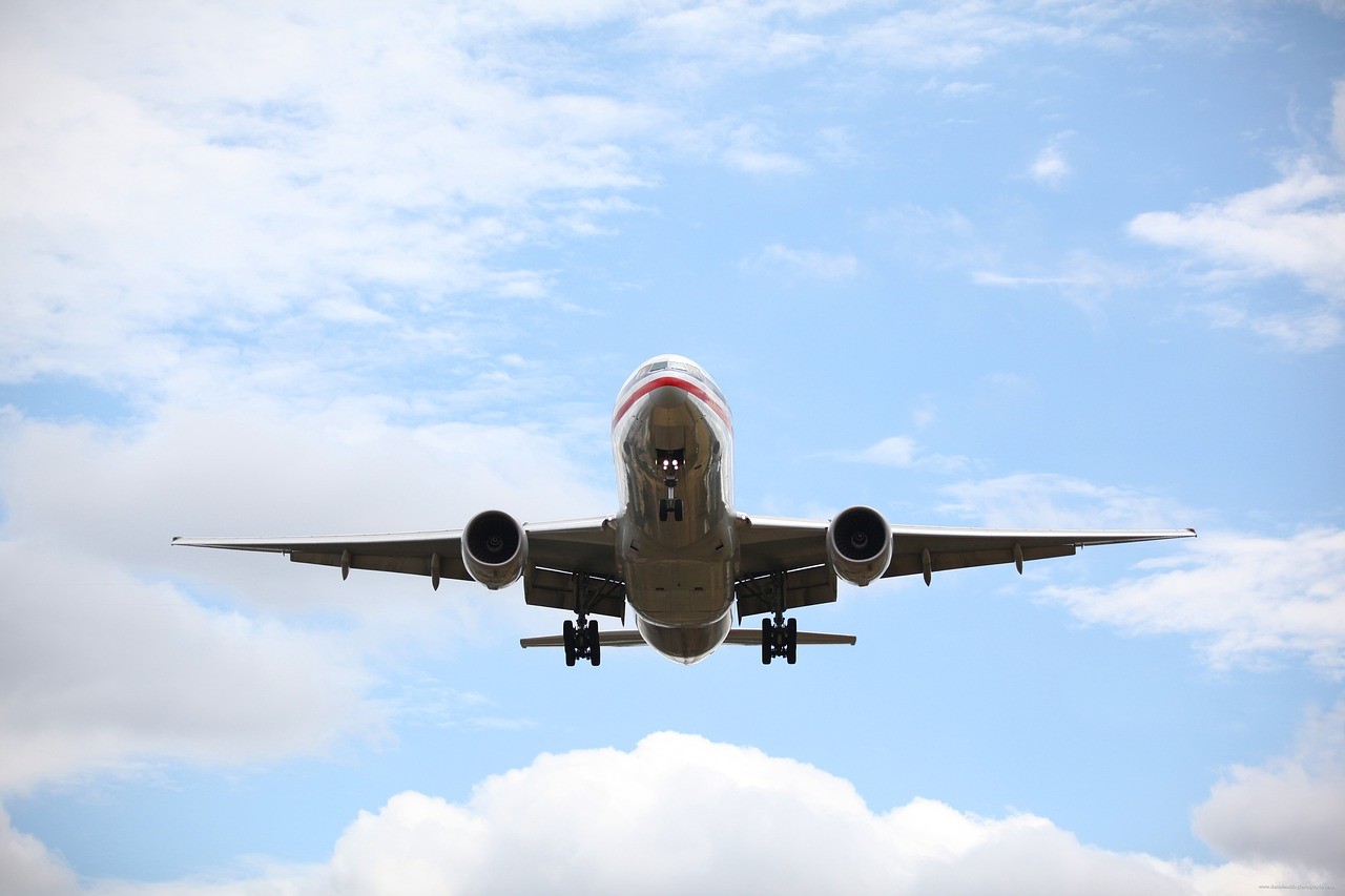 Passenger plane flying through clouds