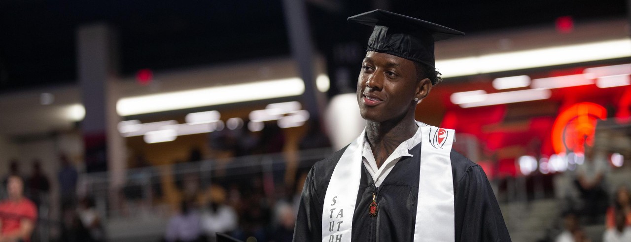 Sauce Gardner in cap and gown at commencement