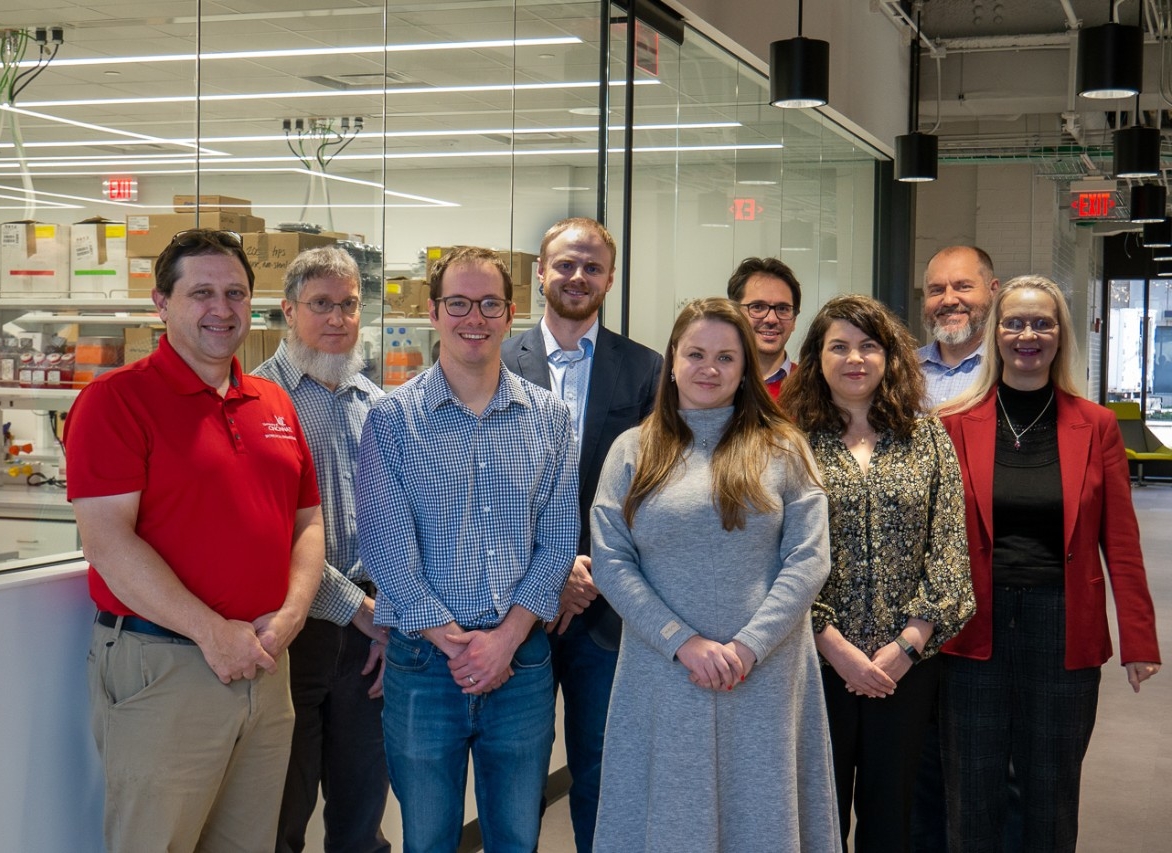 Faculty pose for a group photo.