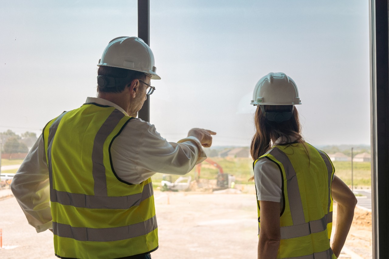 Photo of Steve Kuhn with an associate on a construction site