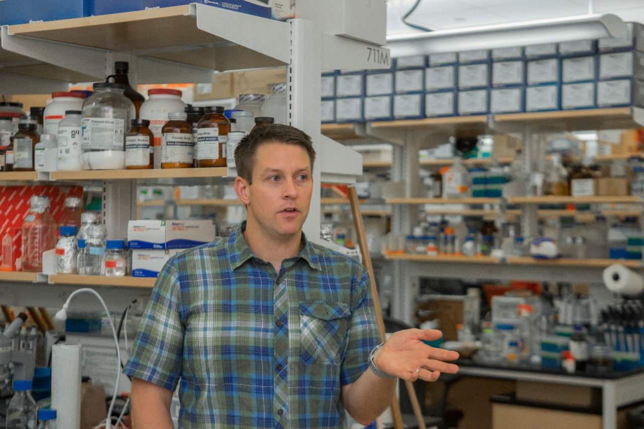 UC Professor Joshua Benoit talks in his lab.
