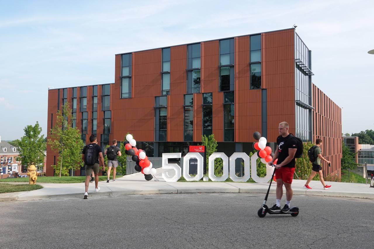 UC celebrates first day of class with 50,000 sign signifying record enrollment outside Clifton Court Hall.