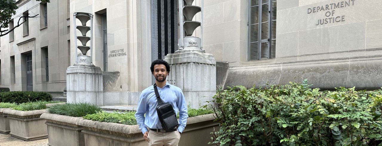 UC student Josh Bennett standing in front of the Federal Building in Washington, D.C.