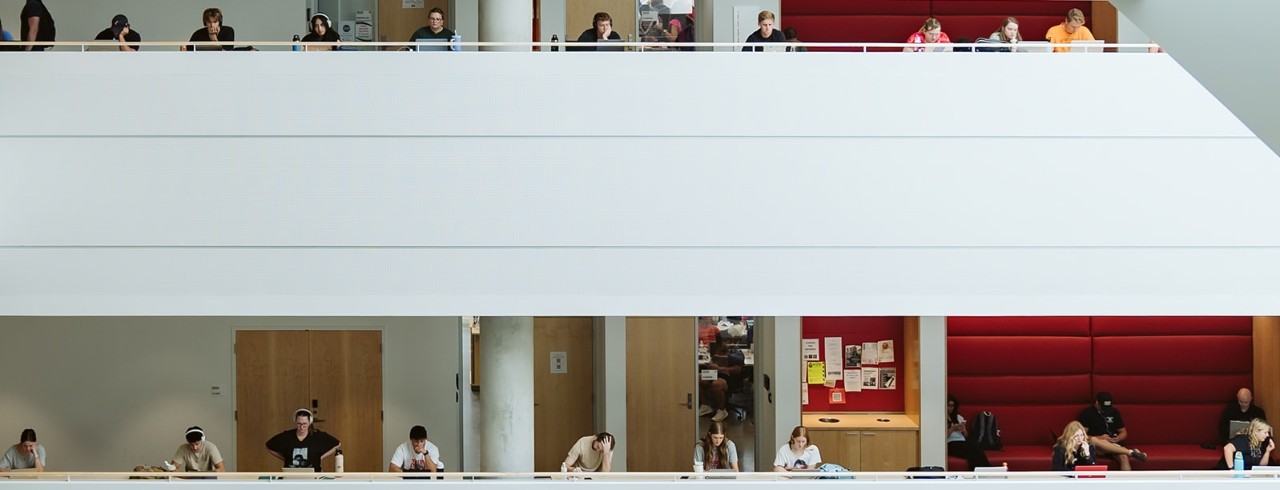 Students study at tables on the second and third floors of Lindner Hall. 