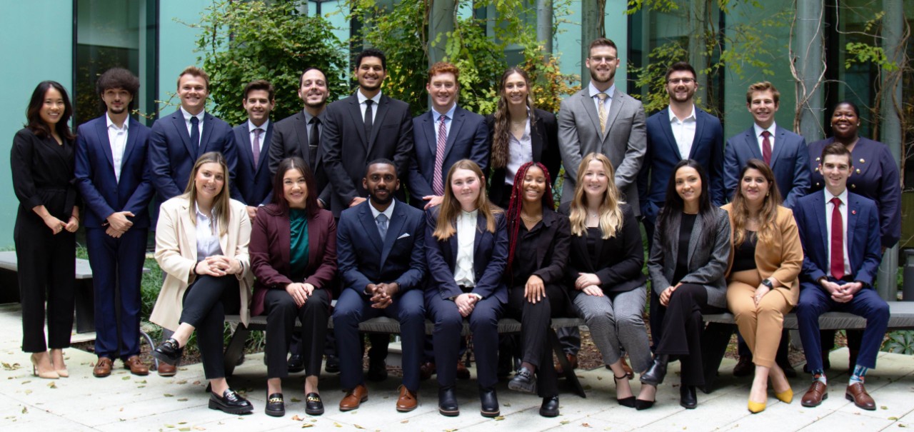 Lindner's full-time MBA class of 2024 in professional dress in Lindner Hall's first floor courtyard.