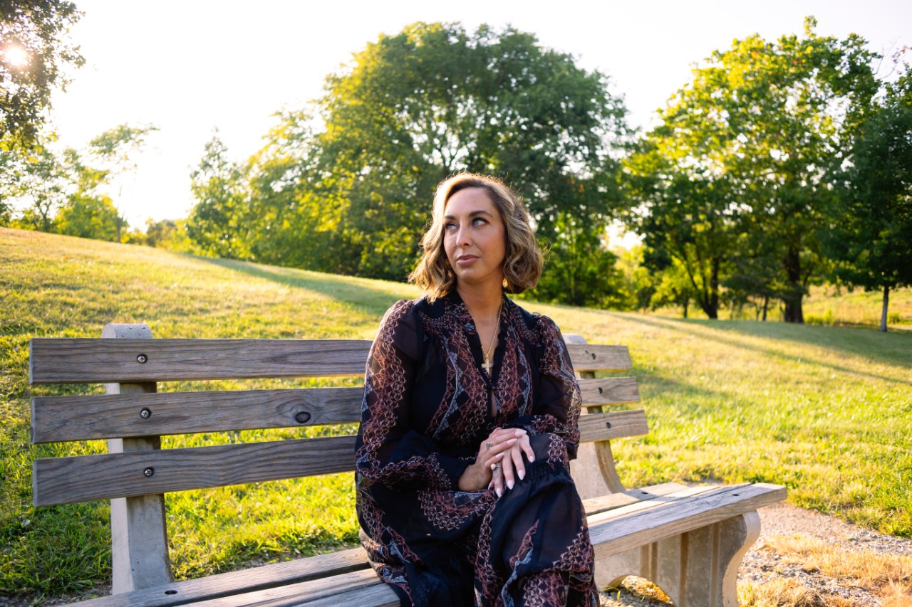 Law student Bethany Notestine sits on park bench