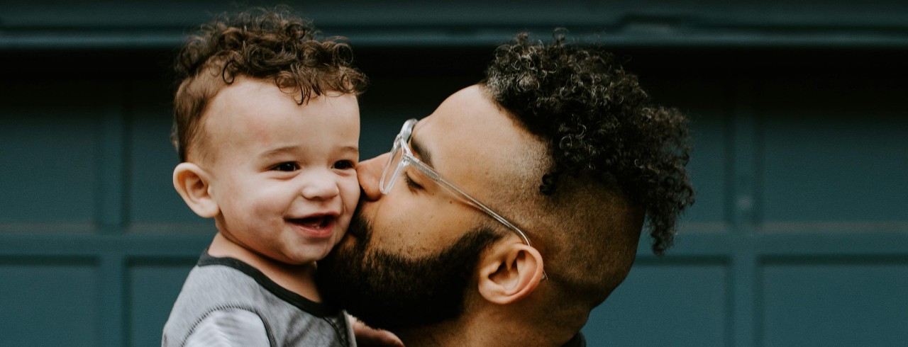 Father holding his baby boy.