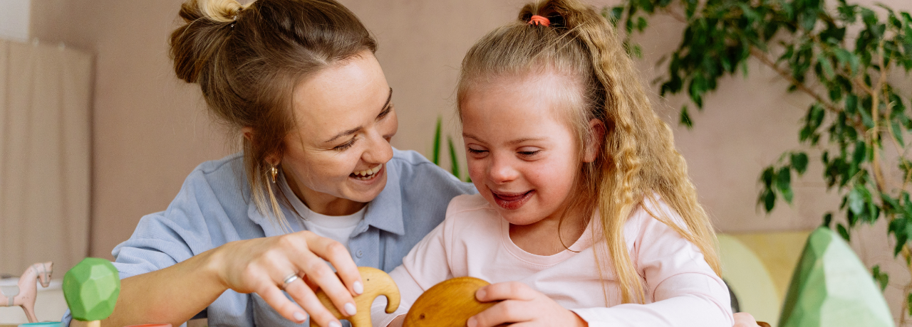 college student with young child at table