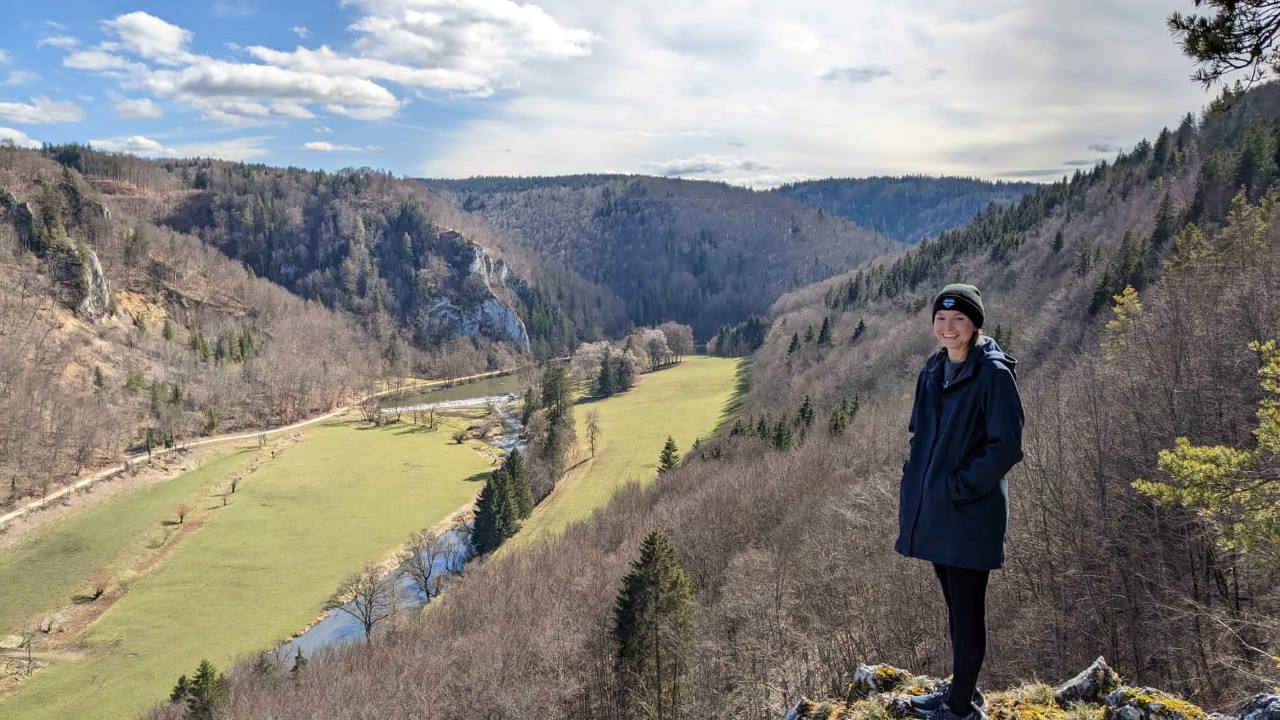 Gretchen Spears stands on a mountain