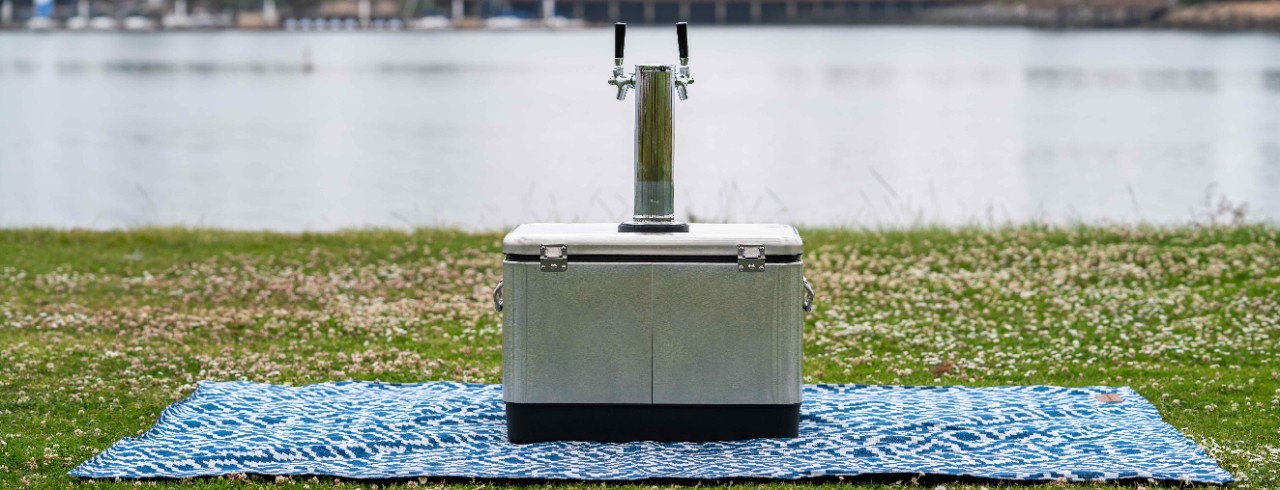 Cooler keg on a blanket outside