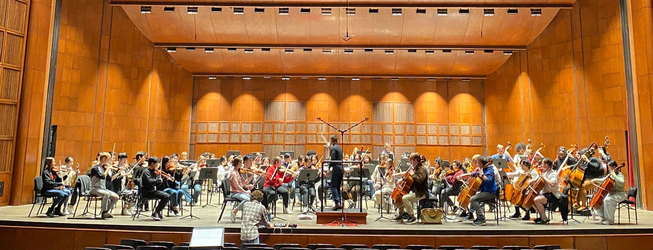 CCM student orchestra on stage during a film scoring class.