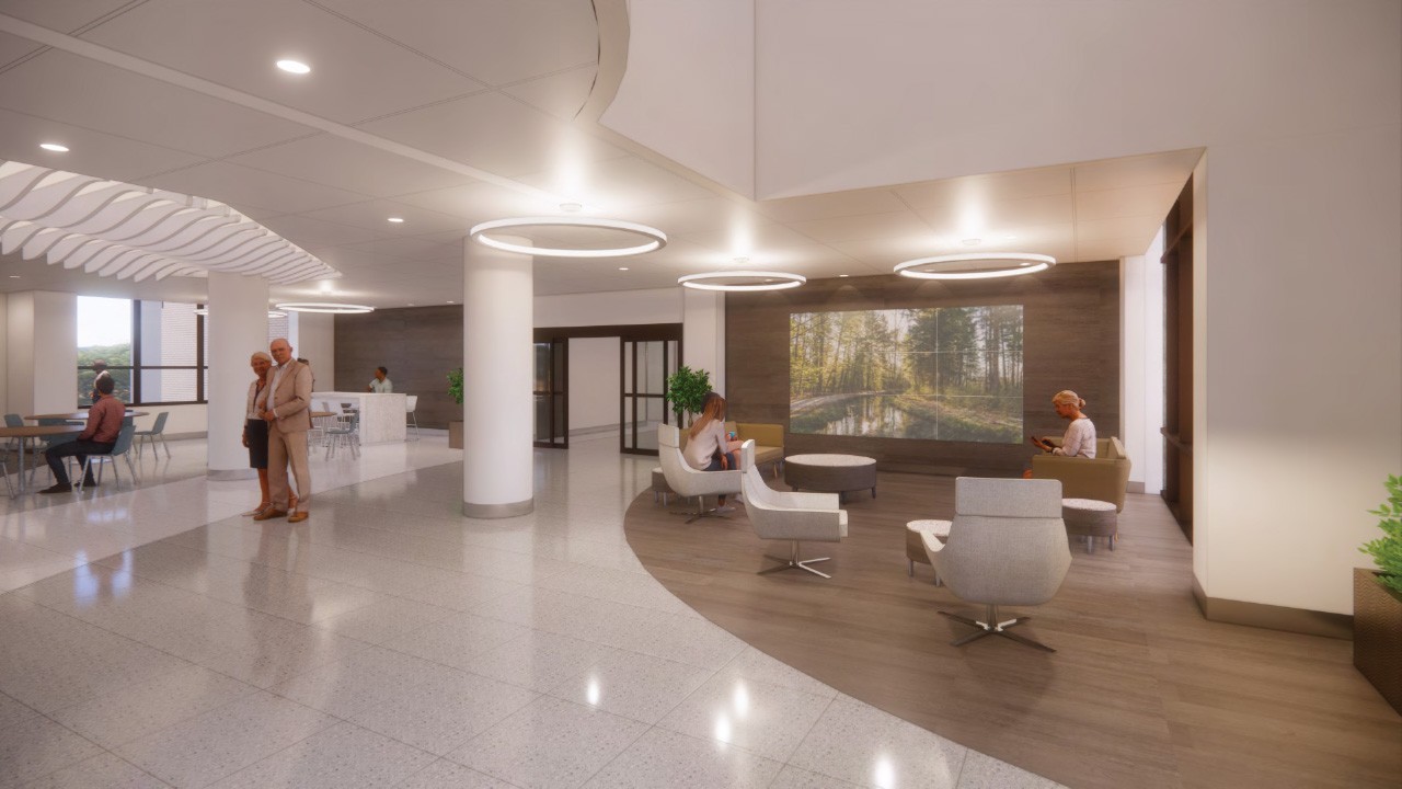 A rendering of the inside of the Blood Cancer Healing Center displays people walking through a hallway and seated in chairs
