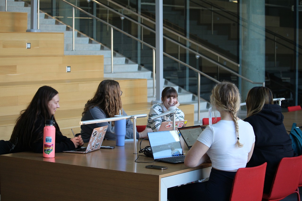 Kaitlyn works with 4 other students in the Atrium