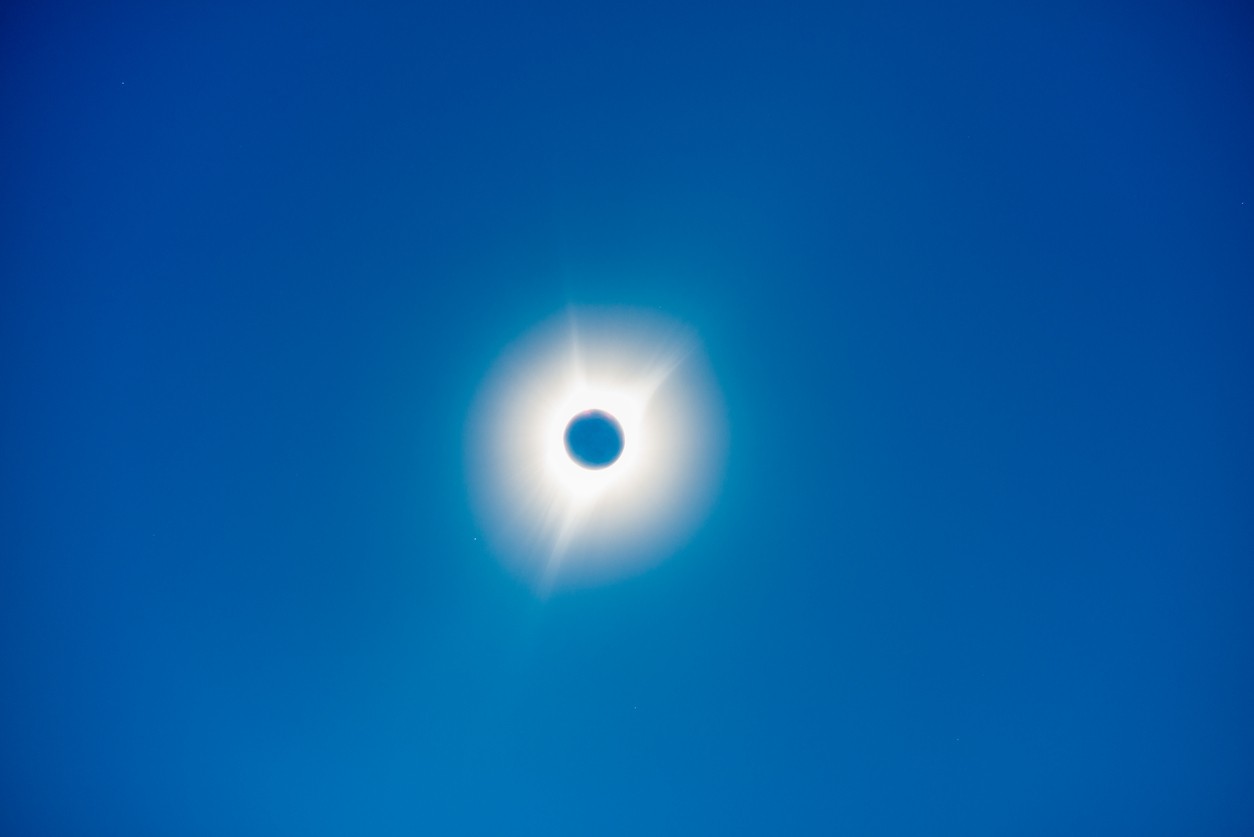 blue sky with a solar eclipse