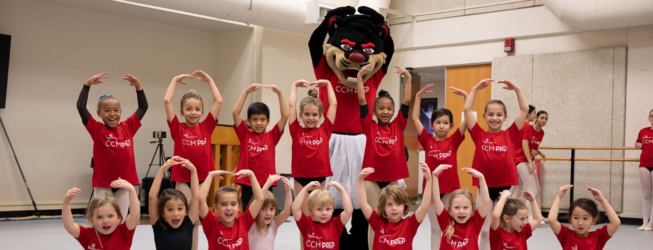 CCM Prep ballet students with the UC Bearcat. Photo by Jeff Corcoran.