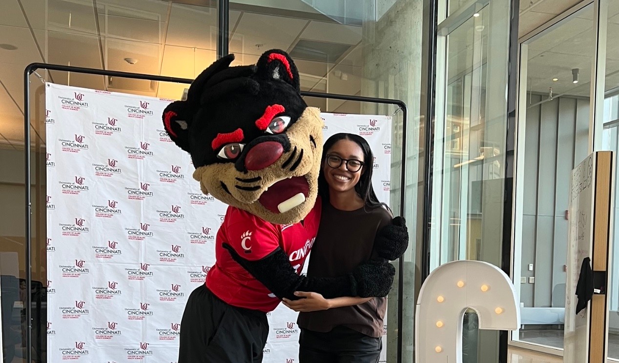 Mariah Talley poses playfully with the Bearcat