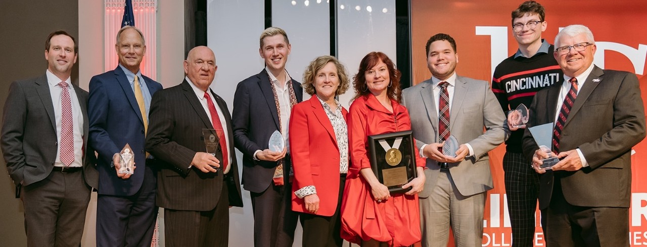 Left to right: Cory Sims, Greg Eling, Distinguished Service Awardee Mario San Marco, Outstanding Young Alumni awardee Nicholas Puncer, Lindner Dean Marianne Lewis, Carl H. Lindner Award for Outstanding Business achievement recipient Lynne Laube, Carl H. Lindner Outstanding Junior Scholarship awardee Matt Santiago, Heart of William J. Keating Jr. Leadership Awardee Richy Richardson, and Distinguished Service Awardee Jerry Fritz.