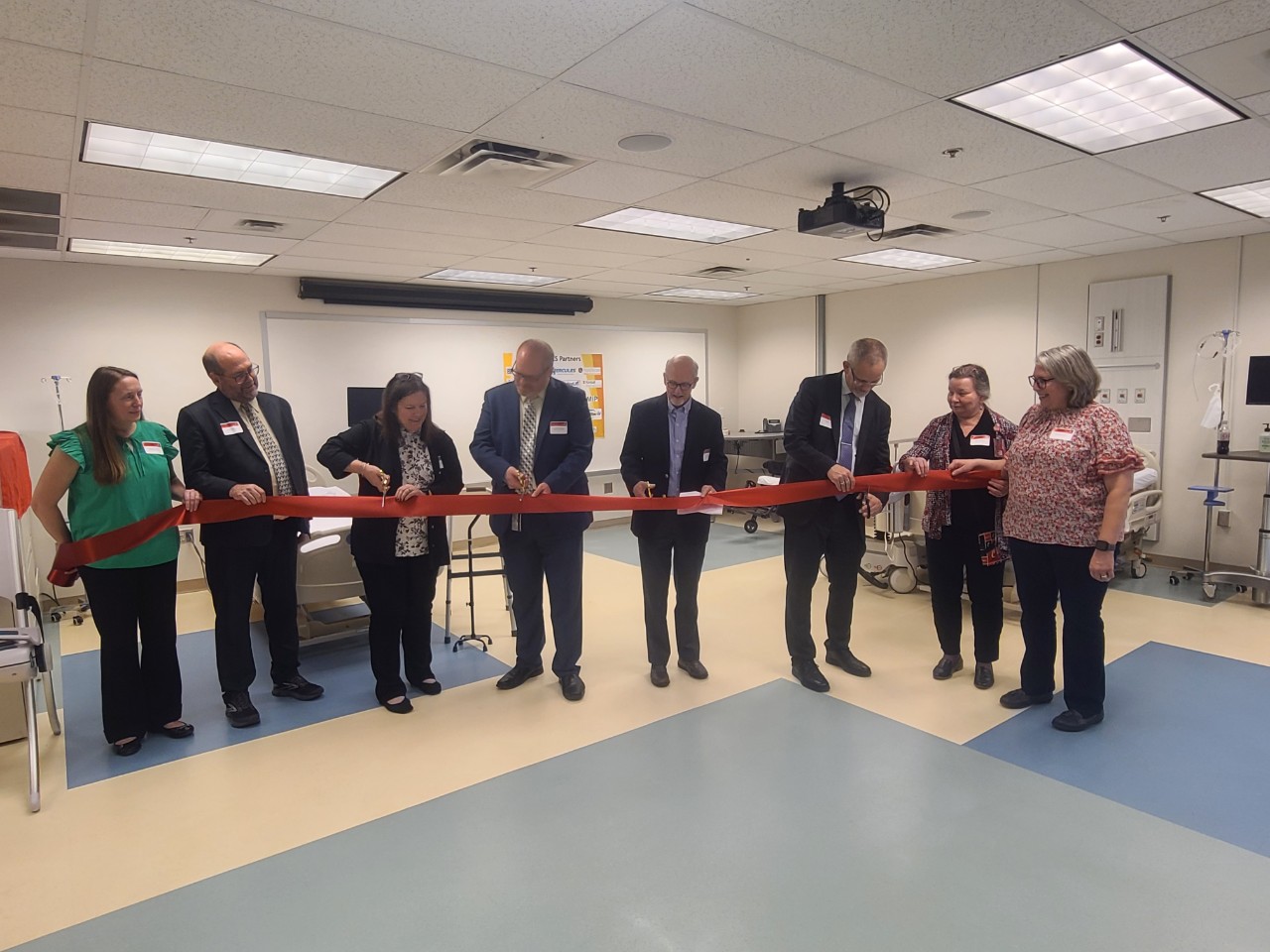 Officials at an indoor ribbon-cutting