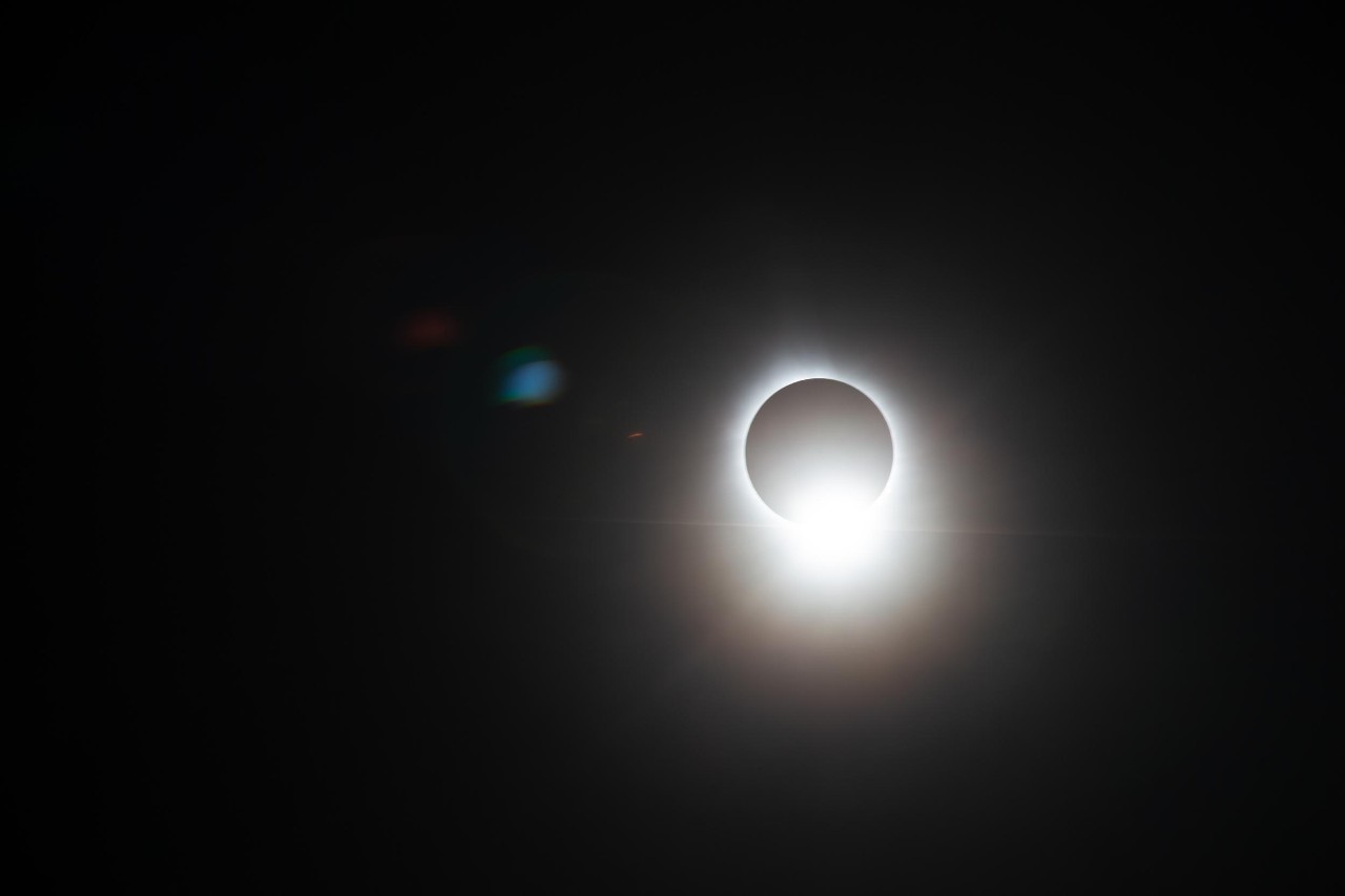 A total solar eclipse creates a diamond-ring effect.