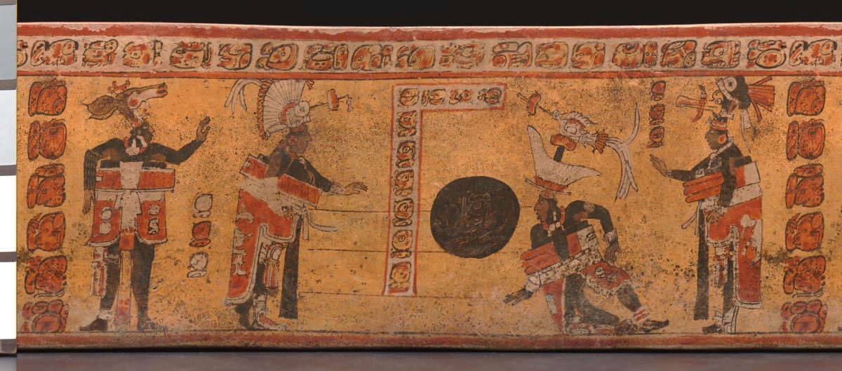A painting on a serving vessel depicts Maya in costume playing with a ball.