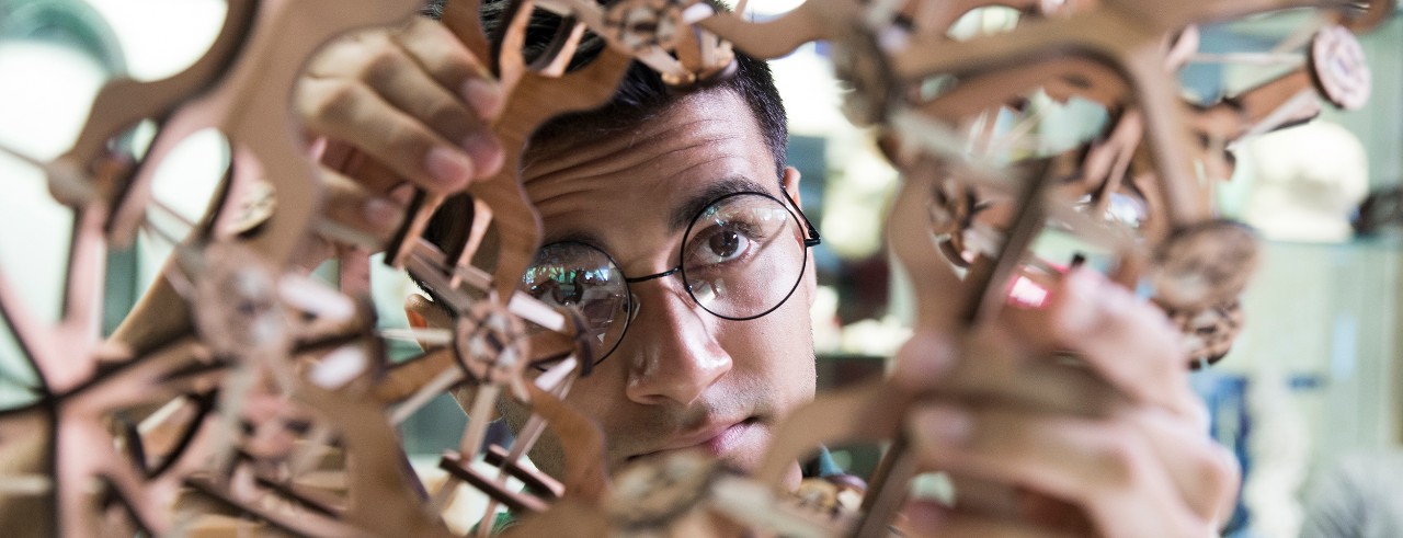 person looking through a complex model structure