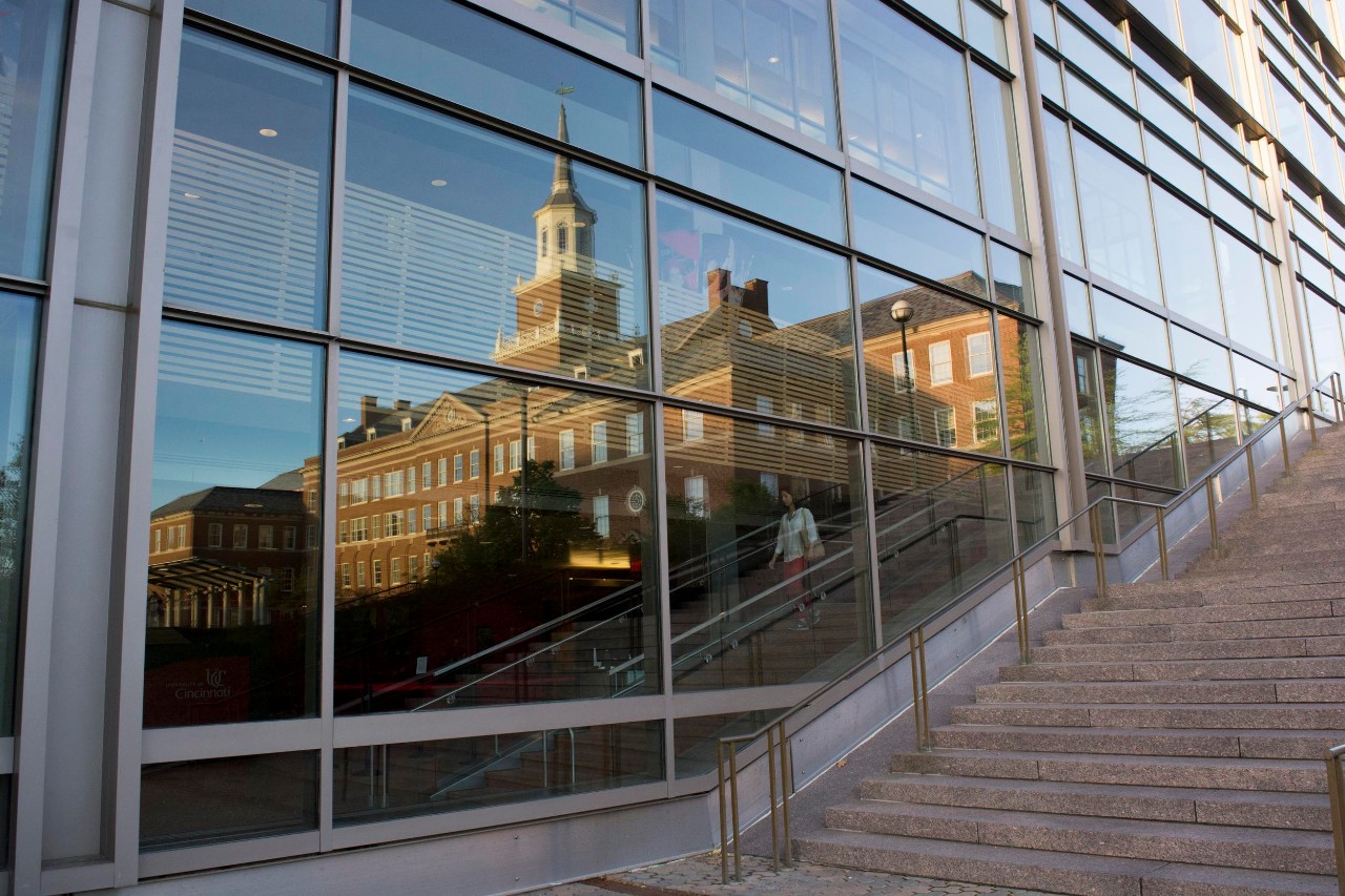 Reflection of UC's Arts and Sciences Hall.