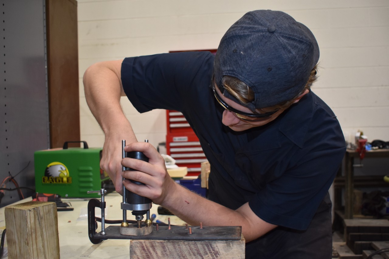 Photo of Joseph Cortas at CEAS' High Bay Structural Lab