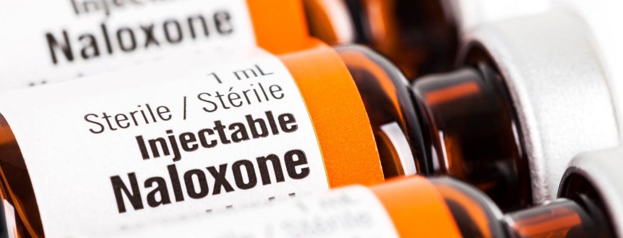 A closeup of three bottles of Naloxone.