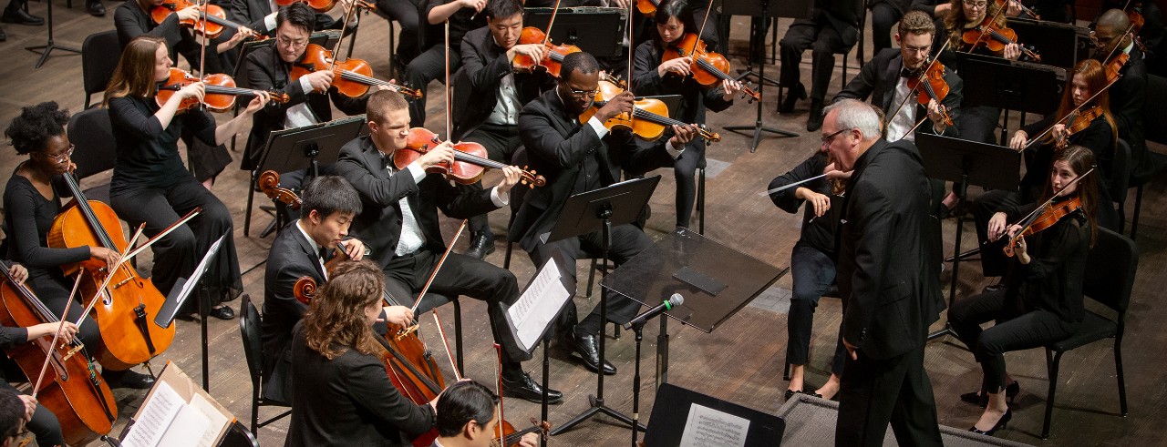 CCM Philharmonia performs on stage.