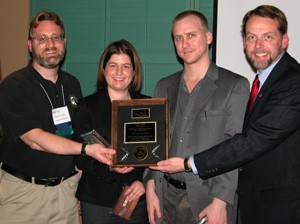 Shawn Carraher, President SBI; Sarah Ramsey and Chris Roesing, UC MBA students; and Charles H. Matthews, Professor.  Not pictured, Stephanie Trautwein, MBA student.