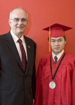 Graduating senior Li Tan, right, with UC President Gregory H. Williams.