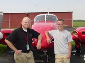 Cory Deming (right) with instructor David Frisby immediately following his Multiengine checkride.