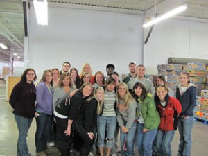 Linsey Koeritz (left) with UC Clermont College students volunteering at the Freestore Foodbank.