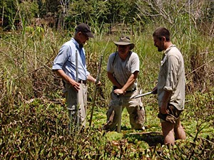 Left to right: David Lentz, Nicholas Dunning and Robert Griffin, coring Tikal reservoir.