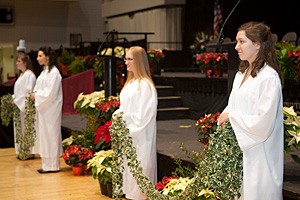 Megan Hathaway (center) at December Commencement
