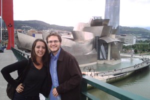 Jonathan Hilton, posing with UC MA student Juliana Martinez, visits the Guggenheim Museum in Bilbao, Spain.