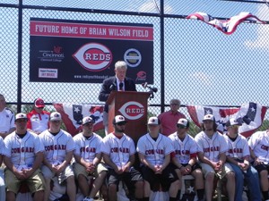 RedÂ s President and CEO Bob Castellini speaks at the announcement, surrounded by UC Clermont College Baseball Team members.