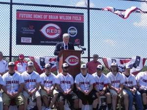 Red s President and CEO Bob Castellini speaks at the announcement, surrounded by UC Clermont College Baseball Team members.