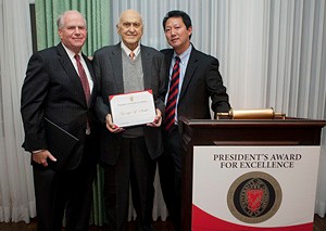 From left, UC Chairman of the Board C. Francis Barrett, Award for Excellence recipient George L. Strike and Interim President Santa J. Ono