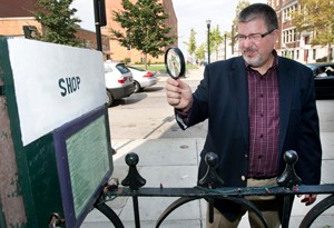 UC researcher James Kellaris examines a sign.