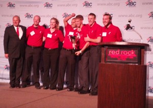 UC Construction Management students celebrate their win while accepting the team's 1st place trophy.