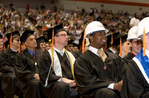 UC's construction management grads wore hard hats for their mortar boards.