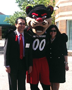Dean Lim and Provost Davenport celebrate technical innovations with the Bearcat at the smart house at Maple Knoll 