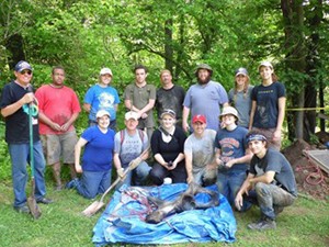 Students surround a newly discovered mastodon hip bone at Big Bone Lick State Park in Kentucky.