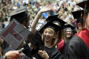 graduate celebrates at commencement