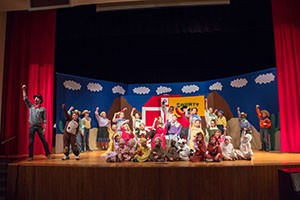 Children perform on stage.