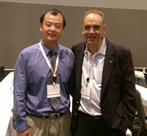 Wei Wei, PhD (left) with Mark Tischler, PhD, at the conference.